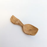 Carved wooden pendant