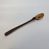 Carved wooden pendant