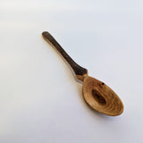 Carved wooden pendant