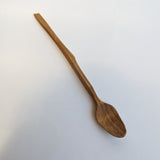 Carved wooden pendant