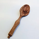 Carved wooden pendant