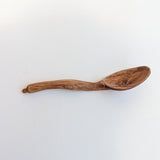 Carved wooden pendant