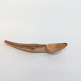 Carved wooden pendant