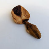 Carved wooden pendant