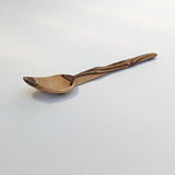 Carved wooden pendant