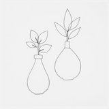 A flower in an iron wire vase